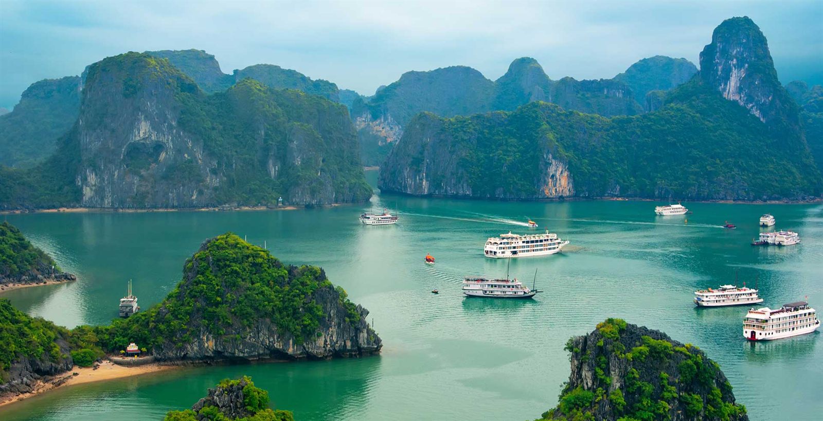 Tour boats among the islands of Ha Long Bay